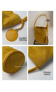 Detailed views of yellow suede bucket bag with stitching, thick base and coin purse charm