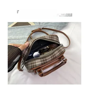 Macro view of interior storage layout showing double zipper pockets for makeup