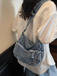 Vintage blue denim crossbody bag with multiple zipper pockets for daily commute