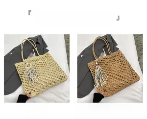 Detail of woven tote bags in beige and khaki with hollow mesh and evil eye charms