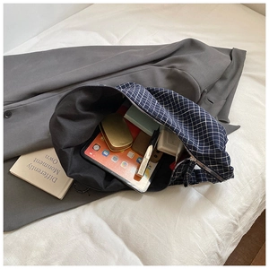 Spacious interior of windowpane canvas tote bag showing large capacity for laptop