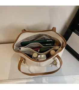 Detailed interior of large tote bag showing compartments and spacious storage capacity