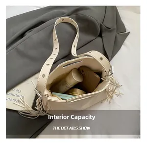 Internal view of beige tote bag showing spacious capacity for phone and cosmetics