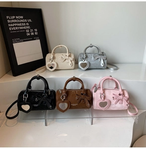 Detailed comparison of mini cylinder bags in five colors with bow and heart mirror charm