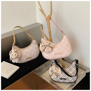 Three checkered crescent shoulder bags in pink, beige, and black with cute rabbit charms