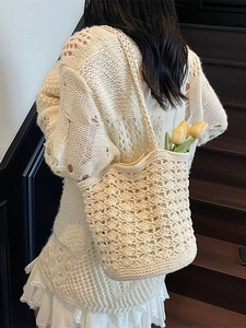 Handmade cream crochet shoulder bag with wave pattern for summer beach vacations