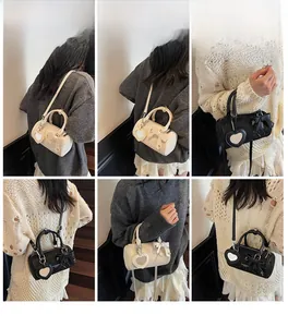Detail showing women's cylinder bag with bow and heart mirror pendant in multiple views