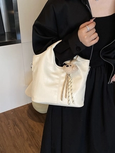 Chic off-white crocodile texture handbag with bear pendant and silver hardware