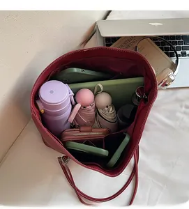 Top view of spacious burgundy tote bag interior showing large capacity for daily items