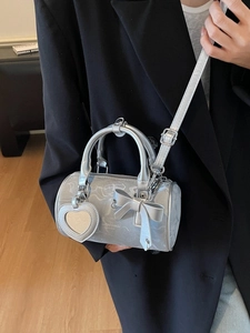 Silver marble cylinder bag with bow and heart mirror charm on adjustable strap