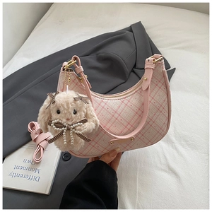 Pink plaid crescent underarm bag with a plush bunny charm and pearl bow detail