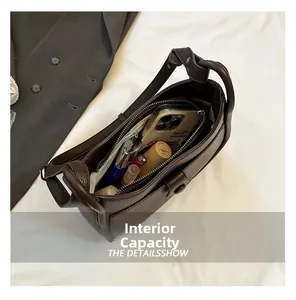 Detailed interior view of brown leather bucket bag showing large storage capacity