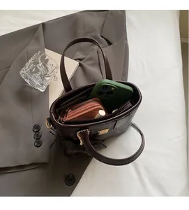 Top view of spacious interior in brown patterned bucket bag showing large capacity