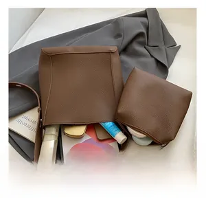 Top view of brown lychee grain bucket bag set with internal storage for tablet and cosmetics