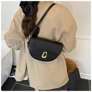 Rear view of a black matte PU leather saddle bag with a horseshoe golden metal buckle