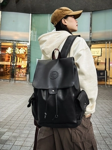 Vintage black leather backpack for students with large capacity and drawstring closure