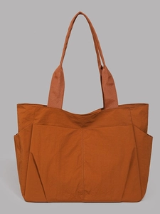 Burnt orange nylon tote bag with large capacity for daily commute and travel use