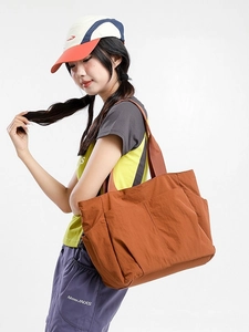 Caramel nylon large tote bag with side pockets for daily commuting and travel use