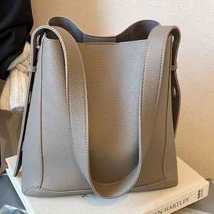 Taupe lychee pattern leather tote bag with wide strap and classic bucket shape