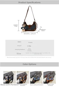 Detail view of denim dumpling bag showing 24cm width dimensions and brown bear keychain