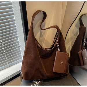 Detail of vintage brown suede tote bag with detachable small coin purse pouch accessory