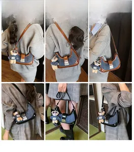 Multiple views of a blue denim hobo bag with leather trim and cute bear charm pendant