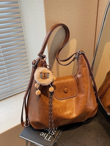 Brown vintage large capacity PU leather tote bag with stylish lion plush charm