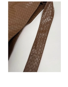 Detailed close-up showing the dark brown woven texture and strap of this tote bag