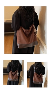 Detail of retro large capacity tote bag featuring brown suede and coffee leather stitching