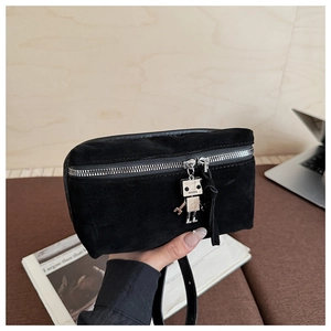 Detail of suede mini bag with silver chunky zipper and robot charm detail