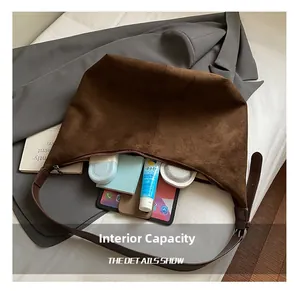 Deep brown faux suede hobo bag interior showing spacious capacity for daily essentials