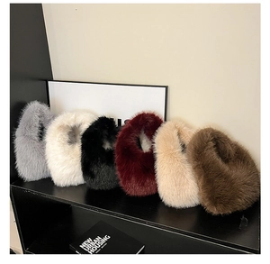 Detailed view of plush faux fur tote bags in six colors displayed on a sleek rack