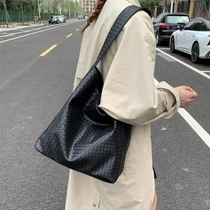 Stylish black woven leather shoulder bag with large capacity for women commuting