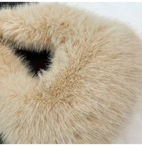 Close-up of soft beige faux fur texture on a luxury winter plush handbag accessory
