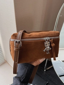 Vintage brown suede messenger bag with a silver metal robot charm and shoulder strap
