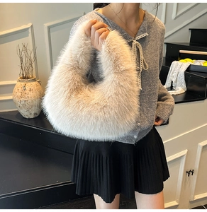 Close-up of fluffy cream faux fur tote bag with plush texture and stylish round handle