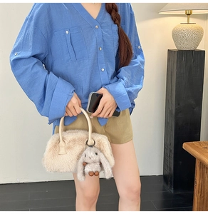 Chic beige plush handbag with cute rabbit pendant accessory for autumn winter fashion