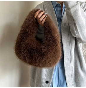 Close-up of brown plush faux fur handbag texture with soft touch and stylish single handle