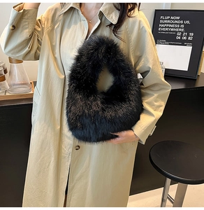Detail of soft black faux fur plush handbag with thick texture shown in a coffee shop setting