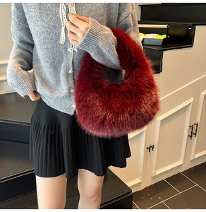 Deep red faux fur handbag styled with a grey cardigan for a trendy autumn and winter look