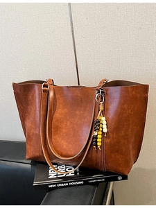Brown vintage faux leather large capacity tote bag with decorative wooden beads and tassels