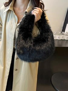 Fashionable black faux fur hobo bag with fluffy texture for autumn winter styling