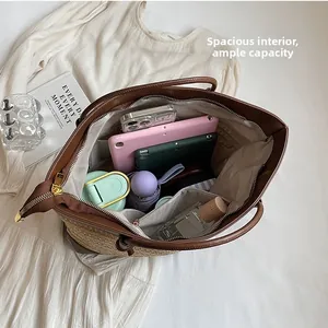 Spacious straw tote bag with brown leather trim showing interior storage for a tablet