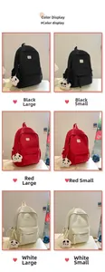 Detail view of nylon backpack color options in black, red, and cream with plush star pendant