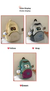 Detailed color display of lightweight waterproof school backpacks in yellow, gray, and green