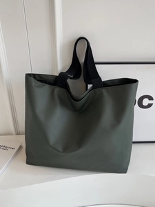 Large olive green nylon tote bag with black handles for casual commuting and students