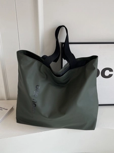 Olive green large capacity nylon tote bag for women featuring black fabric top handles