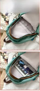 Detail view of mint green nylon backpack showing spacious interior with tablet compartment