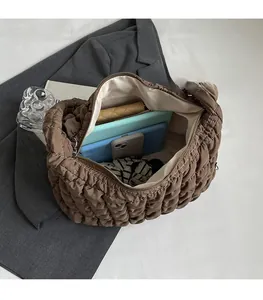 Spacious interior of quilted cloud bag showing room for tablets and essentials