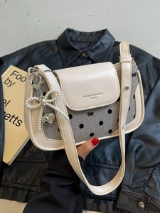 Fashionable beige underarm bag with polka dots, pearl bow and heart charm for women